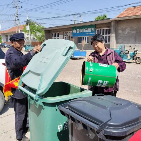 韩庙镇开展“垃圾分类投放点桶边引导”志愿者活动周